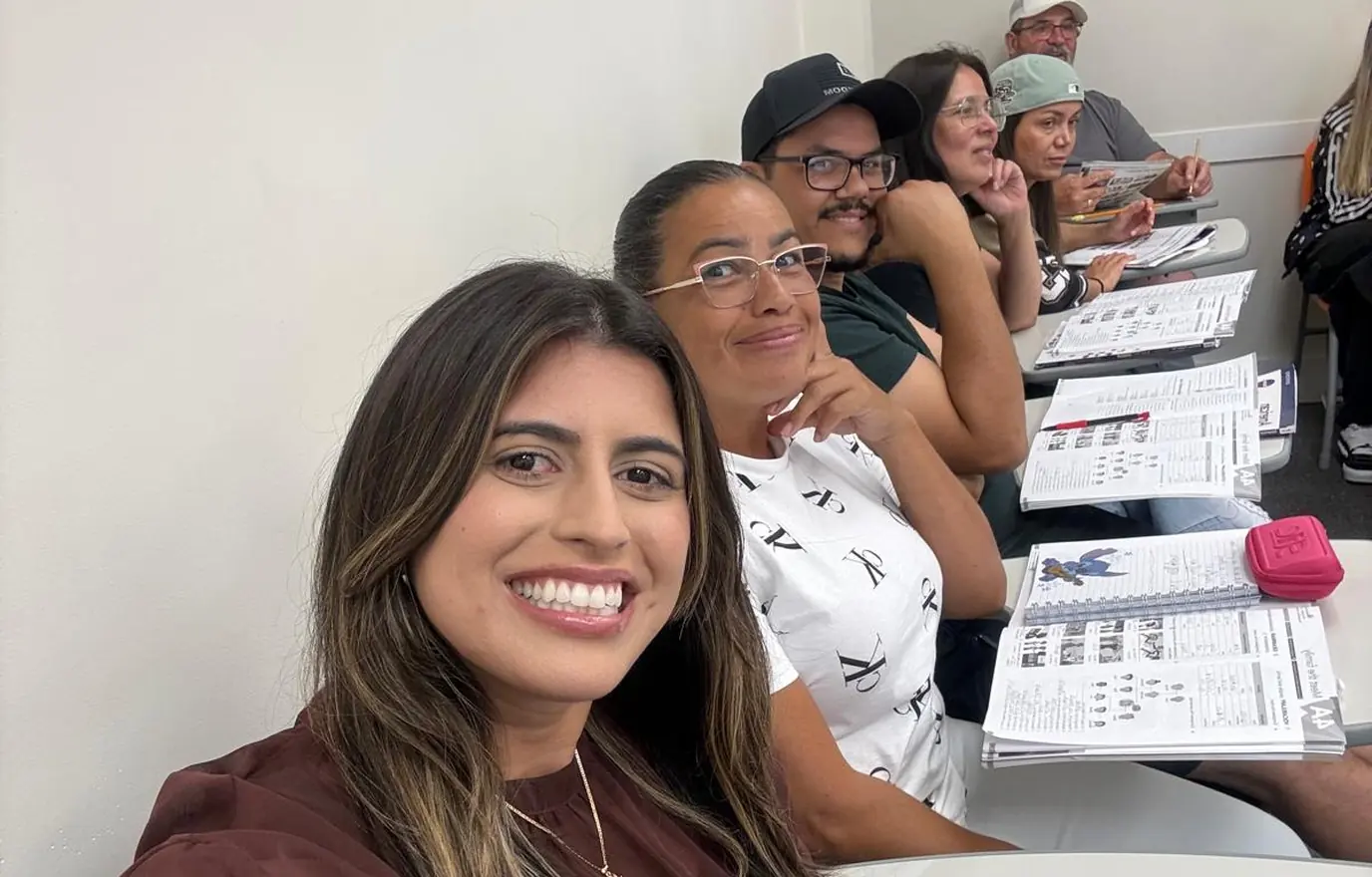 A MILA student taking a selfie with her classmates