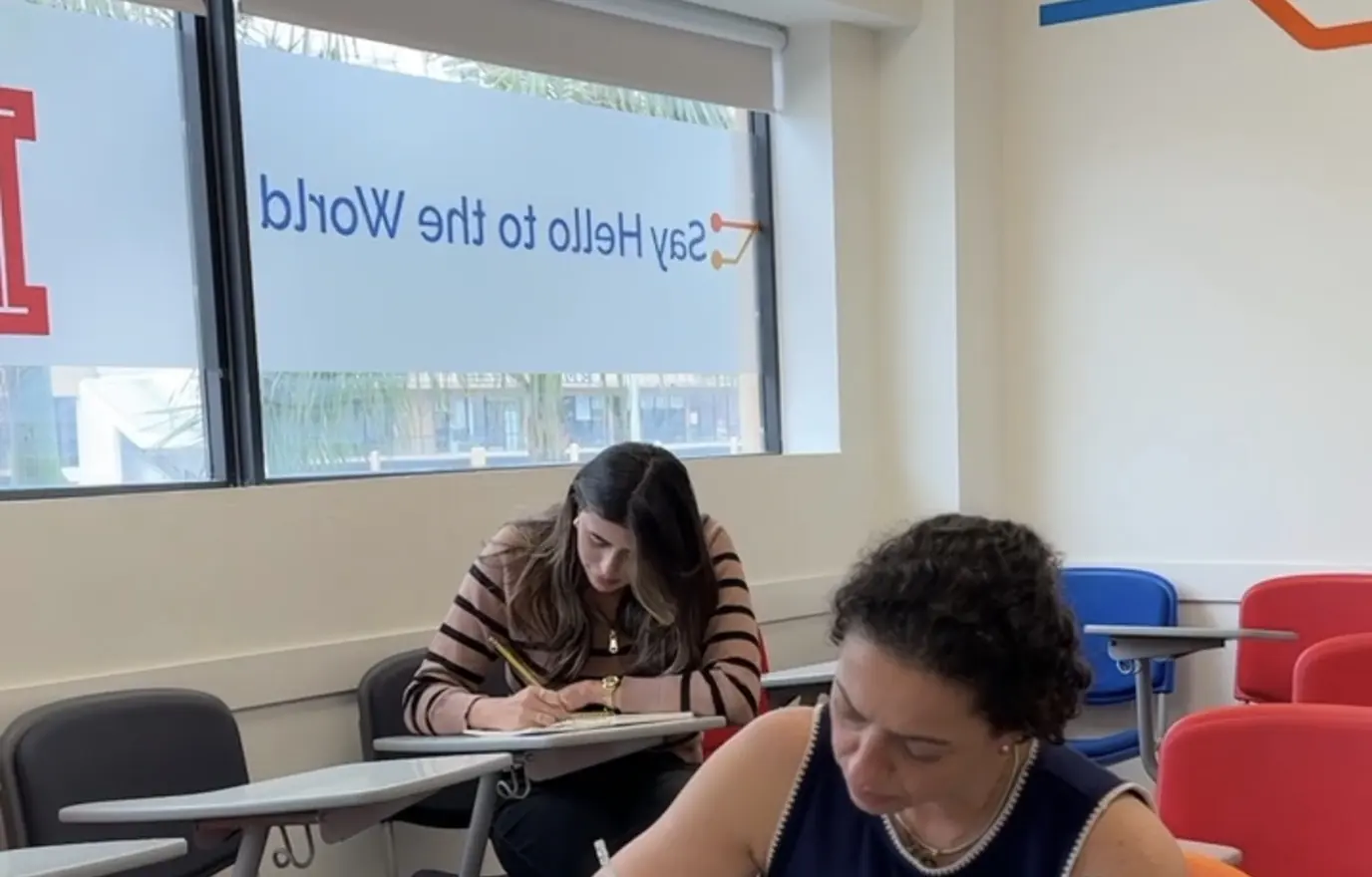 Students writing during a class at MILA