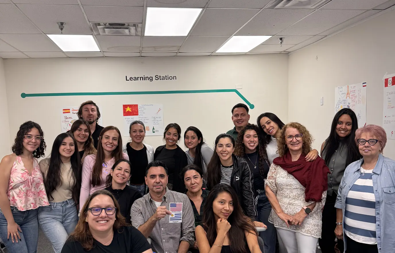 A group of MILA students and teachers smiling together